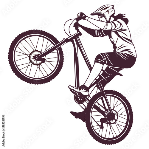 Athletic cyclist performing wheelie on bicycle sport action