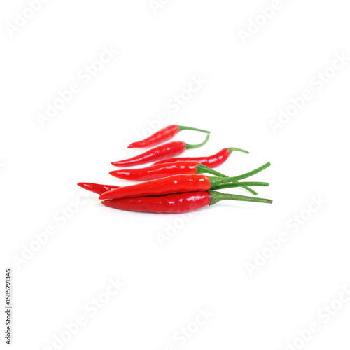 Fototapeta Naklejka Na Ścianę i Meble -  Short red chili peppers laid in a small cluster on clean white background, perfect for use in hot spice recipes, kitchen design, and exotic food packaging.

