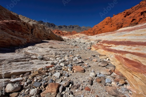 Colorful canyon wash under a clear sky