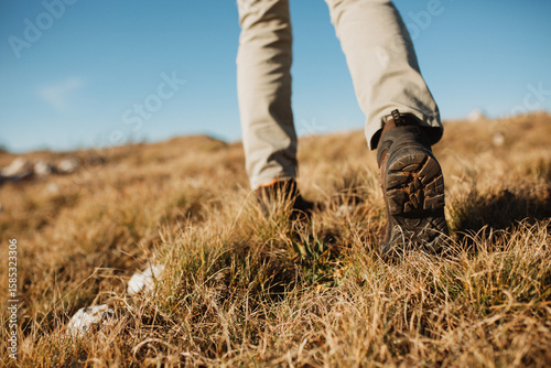 Wallpaper Mural Close up view of hiker boots, walking on the mountain Torontodigital.ca