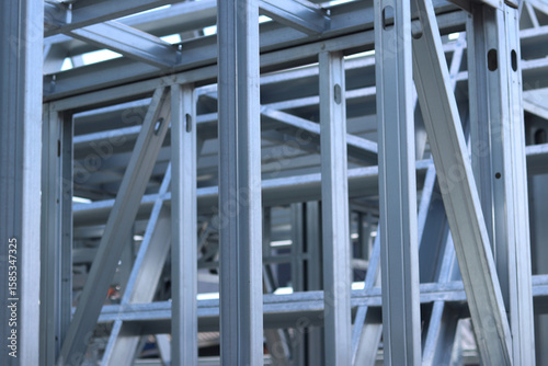 Light steel thin-walled structures. Frames for warehouses, garages and houses. Steel frame construction for construction. Details. Light steel frame fragment close-up. Construction concept