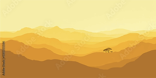 Vibrant yellow layered mountain ridges at dawn with glowing sky and mist