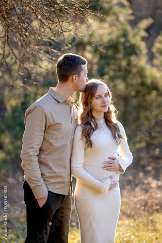 A Couple Joyfully Celebrating Their Pregnancy Announcement Surrounded by Beautiful Nature