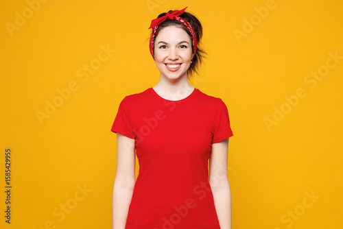 Konstfotografi Young smiling happy satisfied positive Caucasian woman she wearing red t-shirt casual clothes looking camera with toothy smile isolated on plain yellow background studio portrait