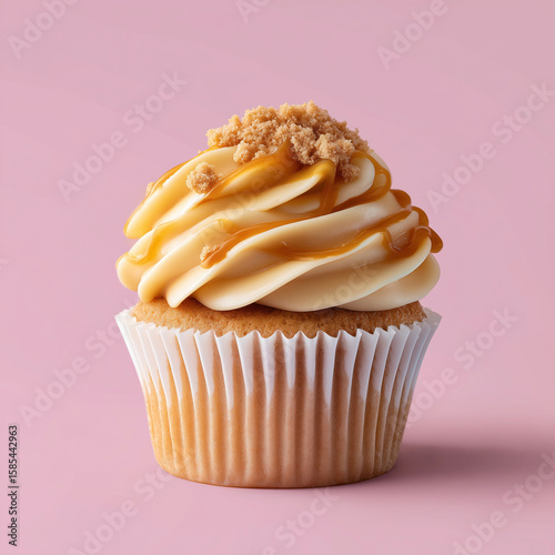 close-up of caramel cupcake with swirled frosting and caramel drizzle, caramel crumble, chocolate cupcake with cream