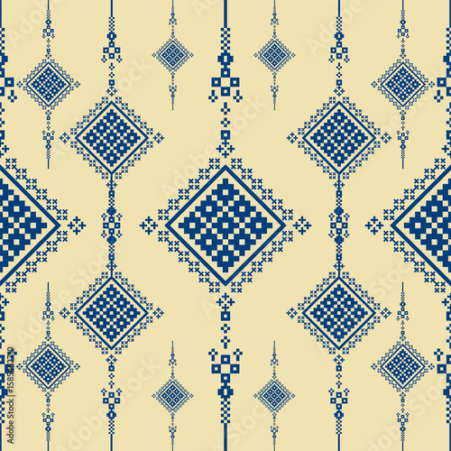 A seamless vertical tribal pixel pattern in dark blue and cream. Inspired by ethnic textile motifs, this minimal geometric design is ideal for fabric, wallpaper, digital print, and boho-style project
