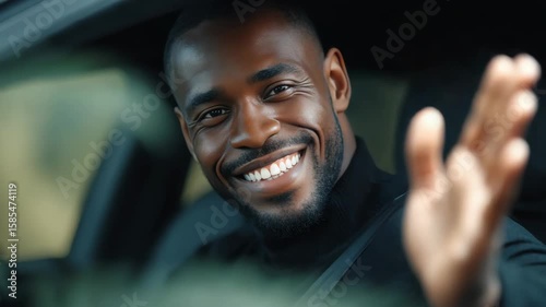 Wallpaper Mural Smiling young male race car driver inside vehicle, waving and enjoying the ride. Torontodigital.ca