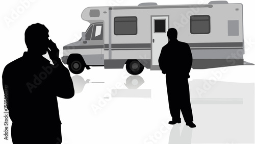 A silhouette of a man on the phone stands before a recreational vehicle with another man nearby