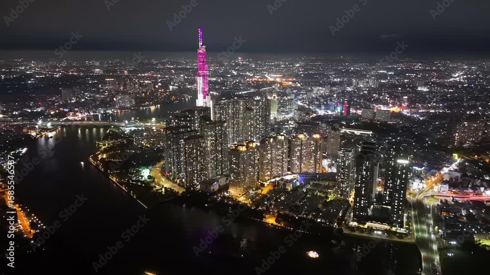 Captivating aerial view showcases the vibrant city lights and modern architecture of Ho Chi Minh City at night. Captivating aerial view showcases the vibrant city lights and modern architecture of Ho Chi Minh City at night.