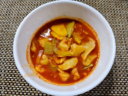 Canvas Print Traditional Korean spicy sujebi soup with hand-torn dough, zucchini, and potato in a rich red chili broth