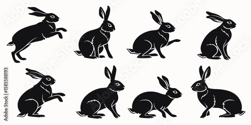 Collection of eight black rabbit silhouettes in various poses isolated on white background
