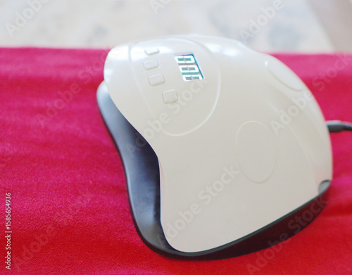 beauty and self-care. uv lamp for manicure and pedicure with permanent or semi-permanent nail polish.