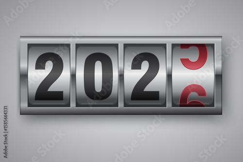 New year mechanical counter showing 2025 switching to 2026 on bright background