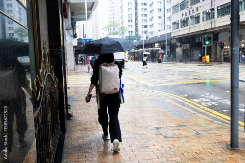 Canvas Print Life lifestyle of local people holding umbrella walking on street while weather