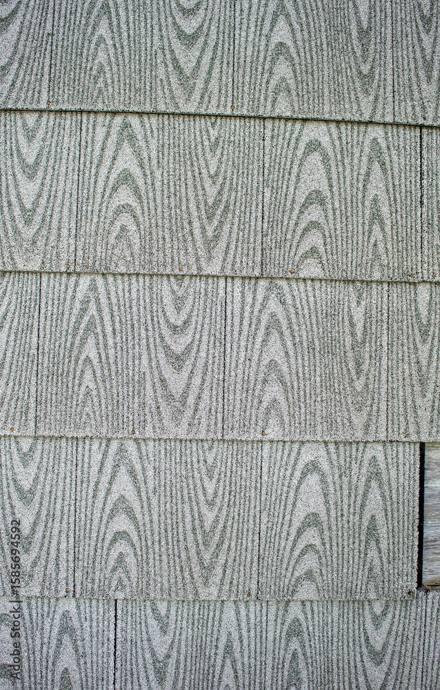 Obraz premium Exterior asphalt based siding needs repair