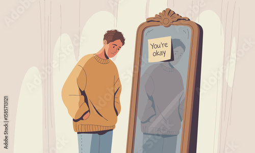 A young man looks sadly at his reflection in a mirror with a "You're okay" note attached, portraying themes of self-doubt and reassurance.