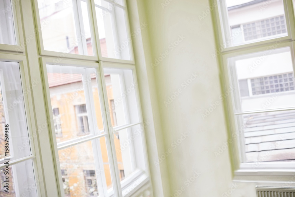 Fototapeta premium White-framed multi-pane windows are showing interior corner scene in flat design with plaster wall
