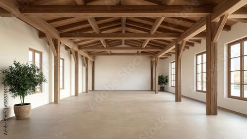 Spacious wooden beam warehouse interior with rustic style, large windows, and natural light