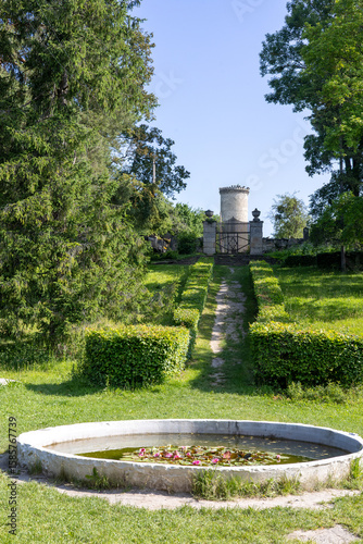 Fototapeta Naklejka Na Ścianę i Meble -  Bright green landscaped park on a summer day