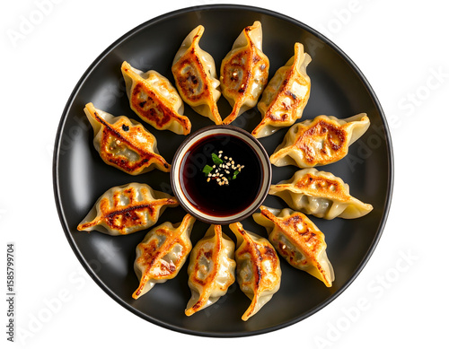  Pan-Fried Gyoza in Circular Pattern on Black Plate, Top View, Isolated on Transparent Background