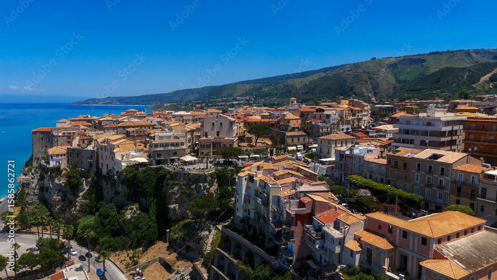 Obraz premium Aerial view of Tropea, a charming town perched on a cliff overlooking the Tyrrhenian Sea in Calabria, Southern Italy