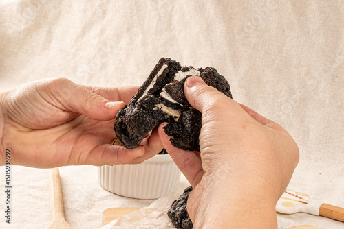 Hands Holding  dark chocolate cookie