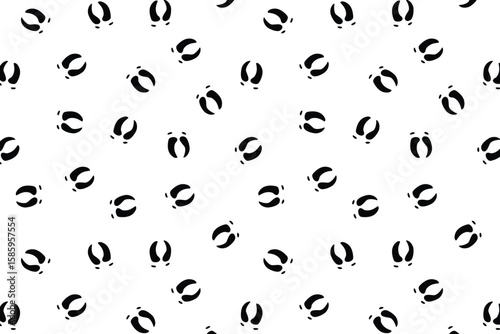 Scatter seamless pattern with black raindeer footprints on a transparent background for wrapping, textile or fabric