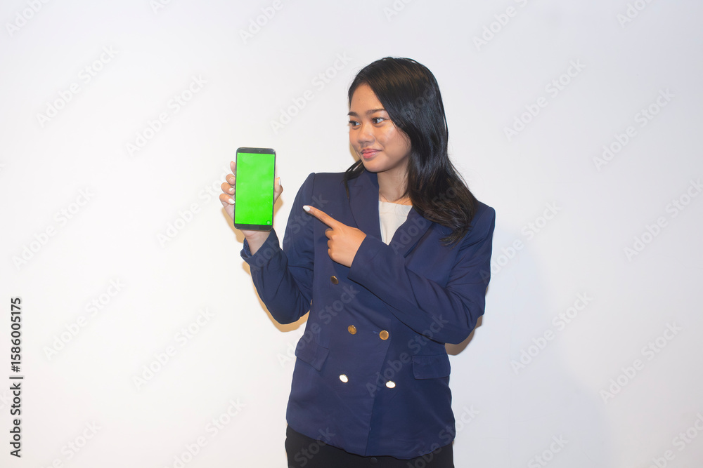 Asian Business Woman Confidently Showing Off Smartphone with Green Screen on Isolated White Background Asian Business Woman Confidently Showing Off Smartphone with Green Screen on Isolated White Background