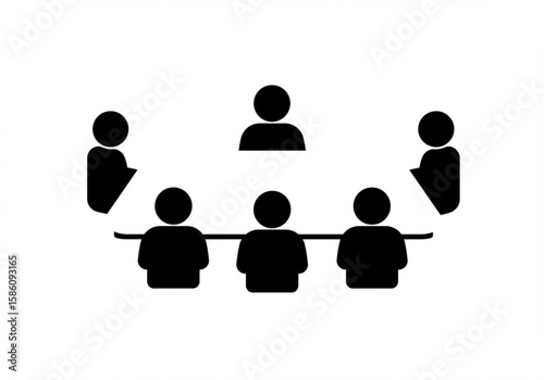 Team meeting around a table with one person standing presenting ideas