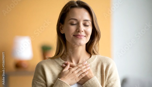 Woman meditating, hands on chest