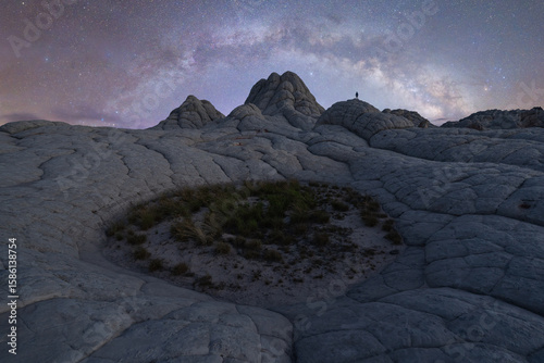 Man beneath Milky Way at White Pocket Arizona nightscape