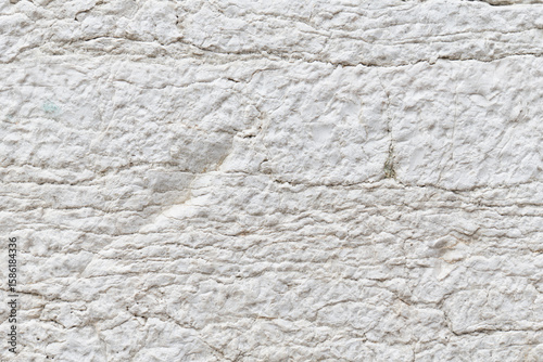 Close-up of rugged white stone texture background