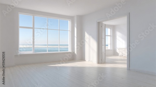 Bright airy empty room with large ocean view window and spacious doorway.
