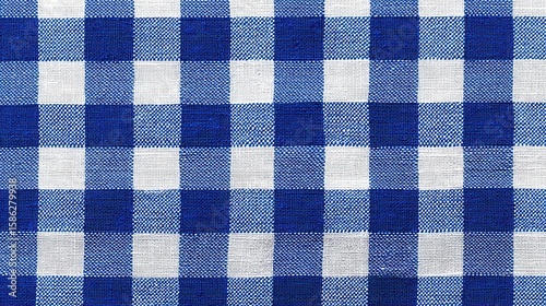 Blue white checkered picnic tablecloth as background, top view
