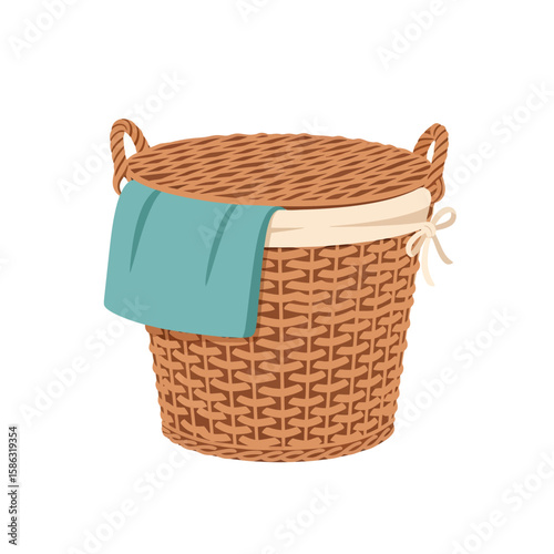 A woven laundry basket with a lid and a blue towel hanging out.