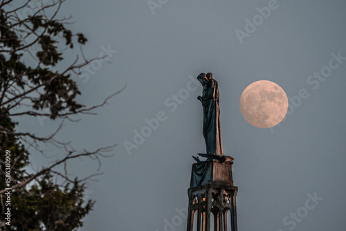 Our Lady of the Ark of the Covenant Church in Abu Ghosh sculpture during a full moon rising and lighting the statue from the back