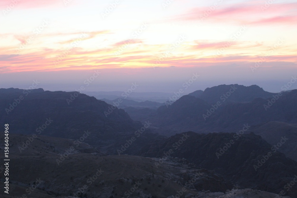 Fototapeta premium Mountain Sunset over Layered Peaks