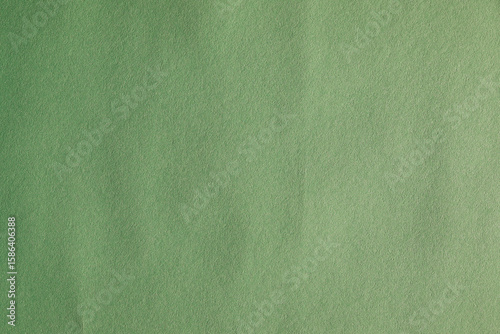 Green wallpaper background with creased and noise texture