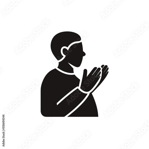 Silhouette of a man in profile with hands raised in a gesture of prayer or reflection
