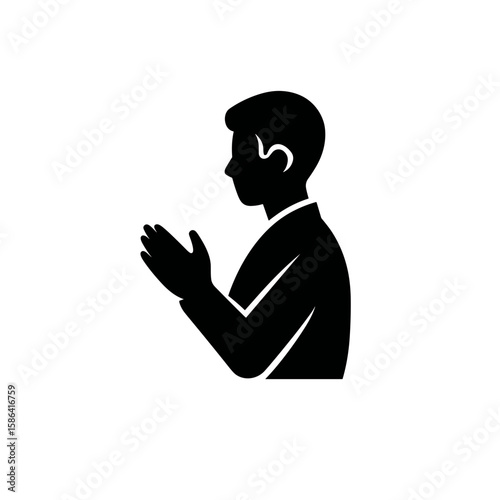 Silhouette of a person in profile with hands together in a gesture of prayer or respect
