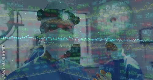 Surgeon adjusting headlamp and initiating drifting translucent market data while performing surgery