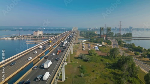 Aerial view of Burlington Canal Lift Bridge spanning waterway beneath highway bridge in Canada