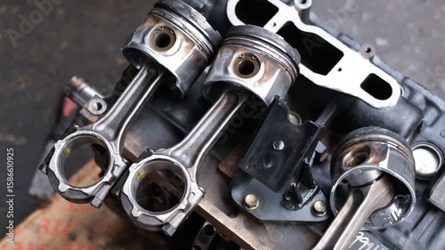 Wallpaper Mural A close up of a car engine with three piston rings. The engine is in a workshop setting Torontodigital.ca