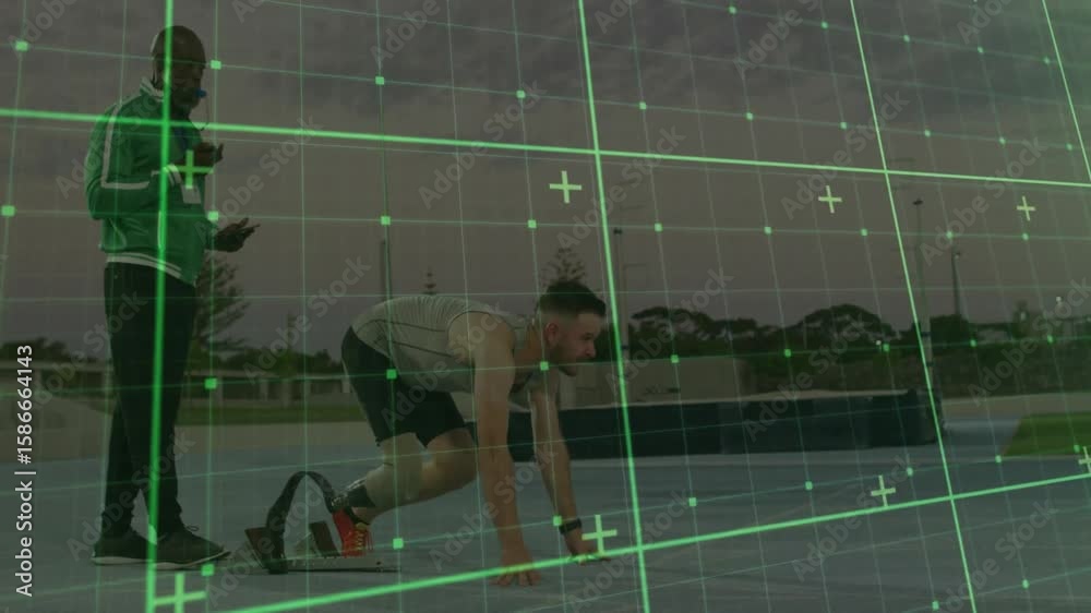 Coach giving phone start command while athlete fixing prosthetic blade and pushing off track blocks
