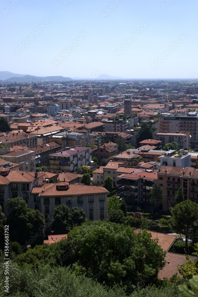 Obraz premium Aerial view, panoramic cityscape of Bergamo with green hills and classic architecture, Italy