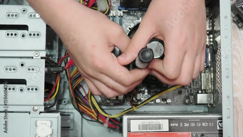 technician hold the screwdriver for repairing the laptop. computer hardware, repairing, upgrade and technology. professional technicial at workplace concentrated. focus on hands