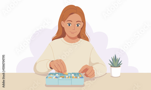 Woman with red hair sorts pills into a blue pill organizer on a table with a small potted plant.