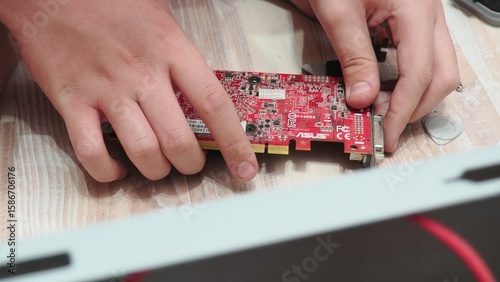 technician hold the screwdriver for repairing the laptop. computer hardware, repairing, upgrade and technology. professional technicial at workplace concentrated. focus on hands