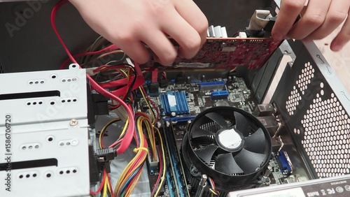 technician hold the screwdriver for repairing the laptop. computer hardware, repairing, upgrade and technology. professional technicial at workplace concentrated. focus on hands