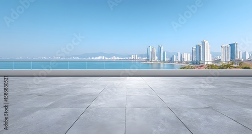 Empty rooftop overlooking a coastal city skyline.